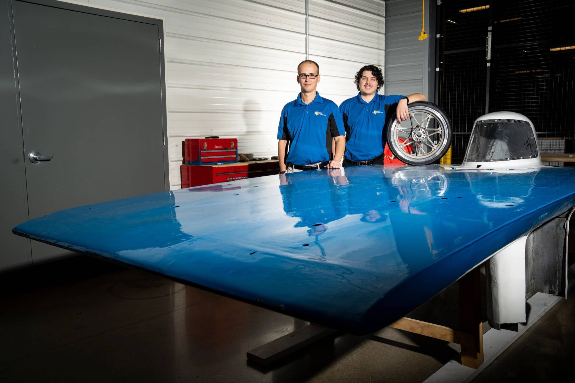 GVSU students posing with their project in a lab